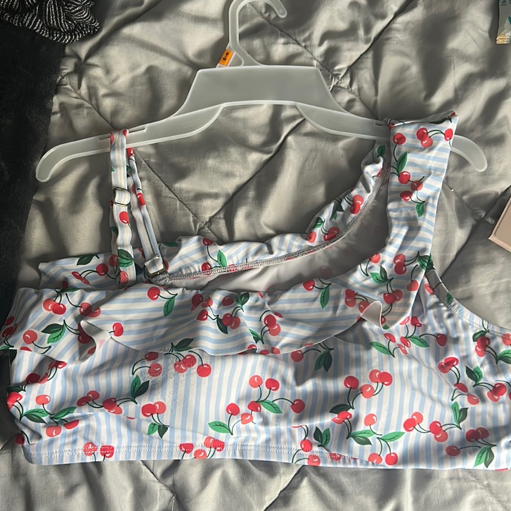 This is a cherry swimsuit top from Belk